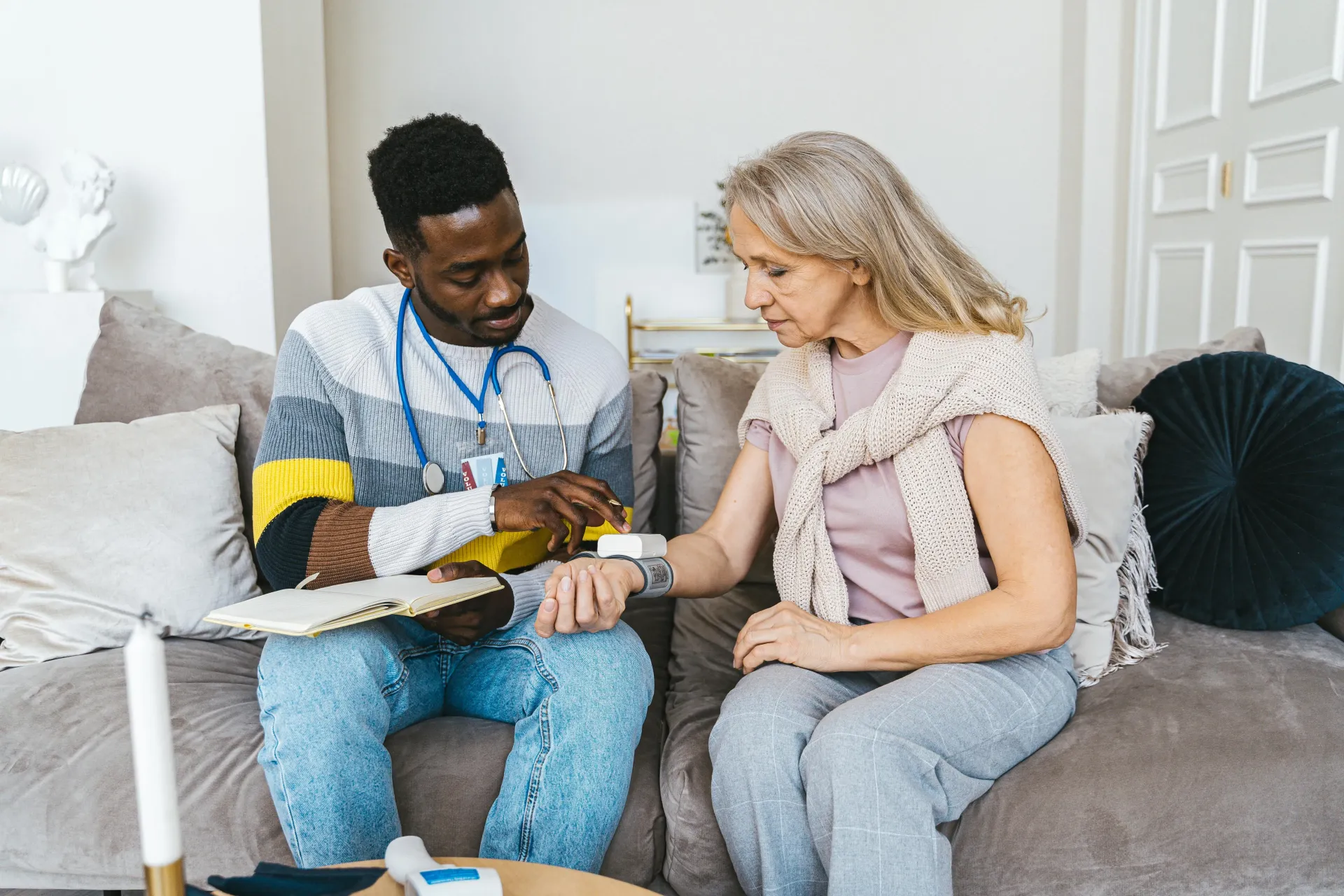 A caregiver assisting an older adult with attentive, non-medical support at home in New Jersey