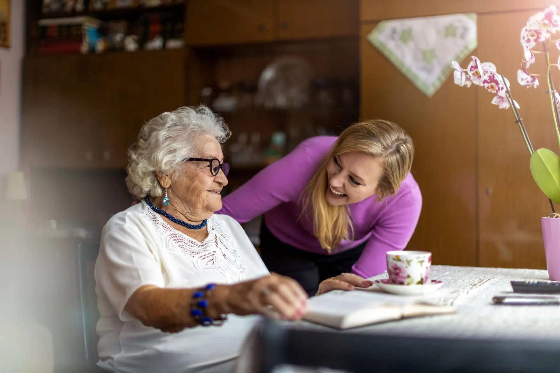 A caregiver and older adult sharing warm companionship at home in New Jersey